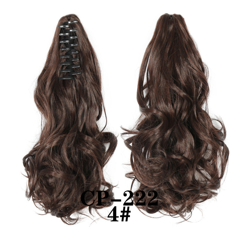 Wavy ponytail with curly hair and a tiger clip