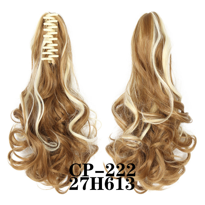 Wavy ponytail with curly hair and a tiger clip