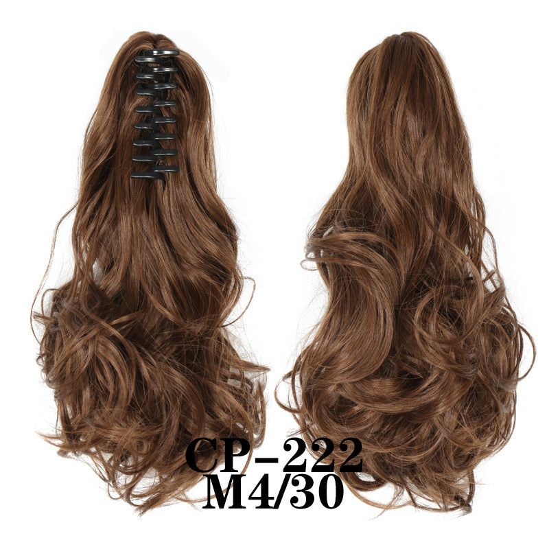 Wavy ponytail with curly hair and a tiger clip