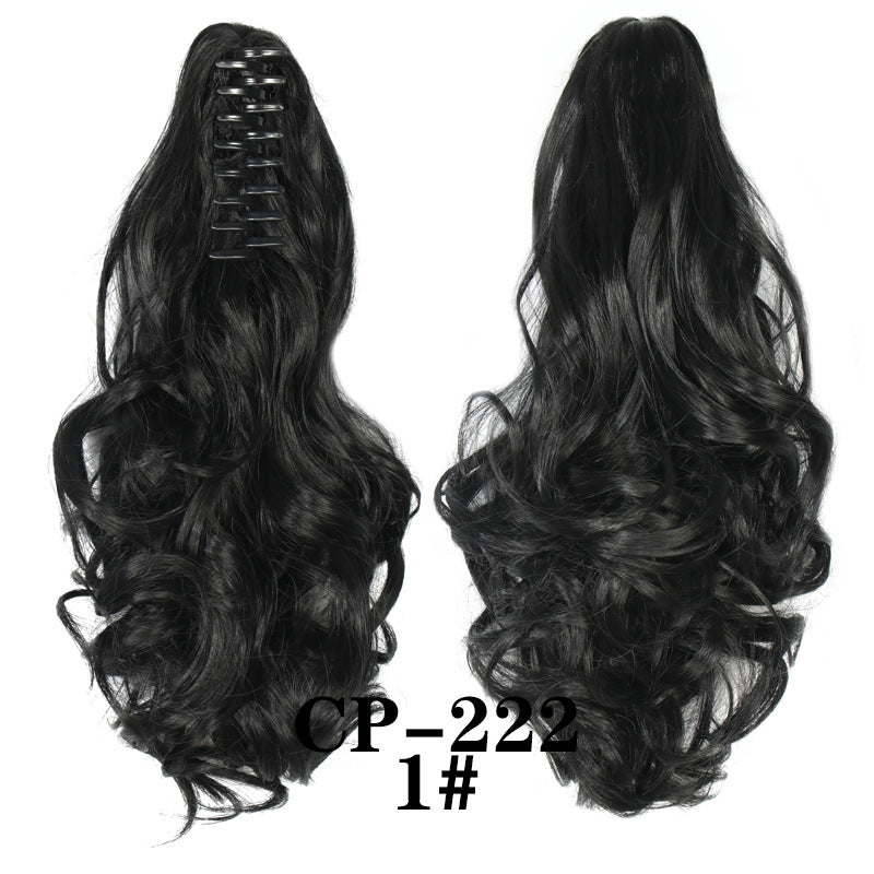 Wavy ponytail with curly hair and a tiger clip