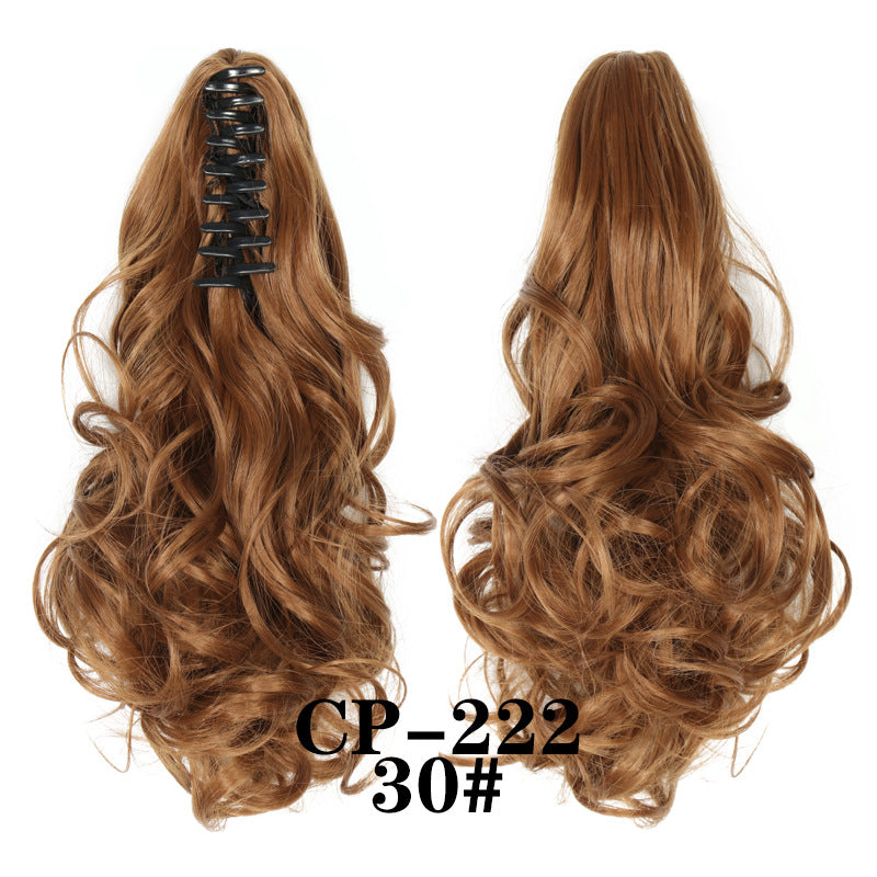 Wavy ponytail with curly hair and a tiger clip