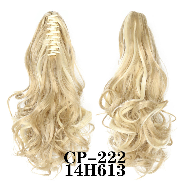 Wavy ponytail with curly hair and a tiger clip