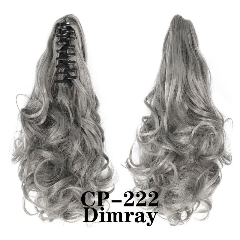 Wavy ponytail with curly hair and a tiger clip