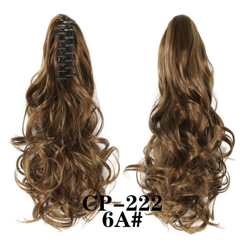 Wavy ponytail with curly hair and a tiger clip