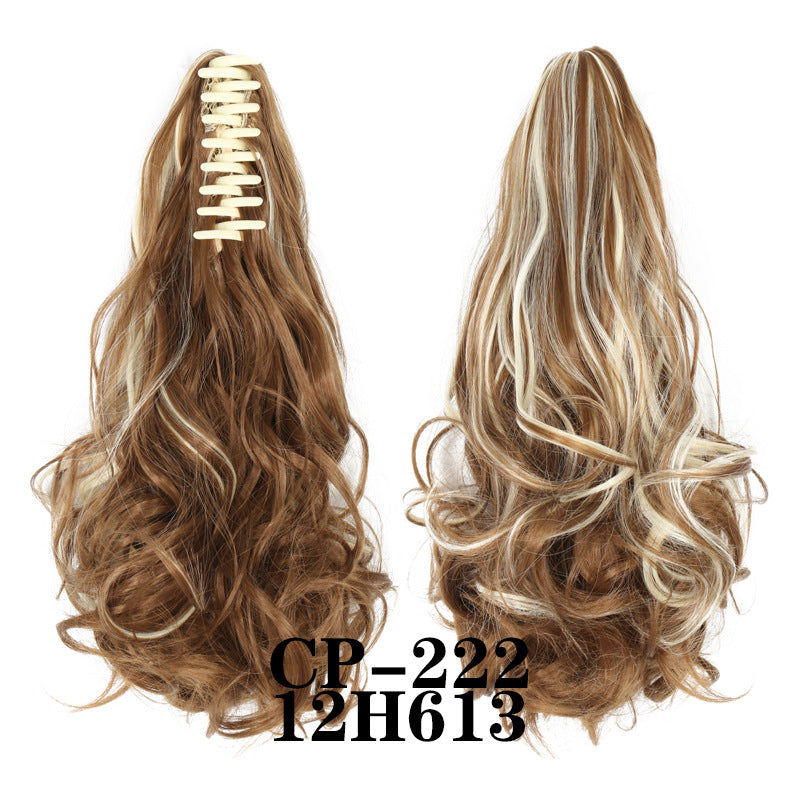 Wavy ponytail with curly hair and a tiger clip