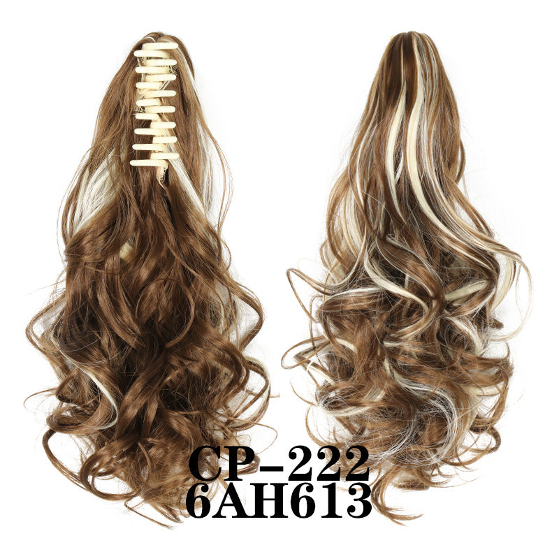 Wavy ponytail with curly hair and a tiger clip