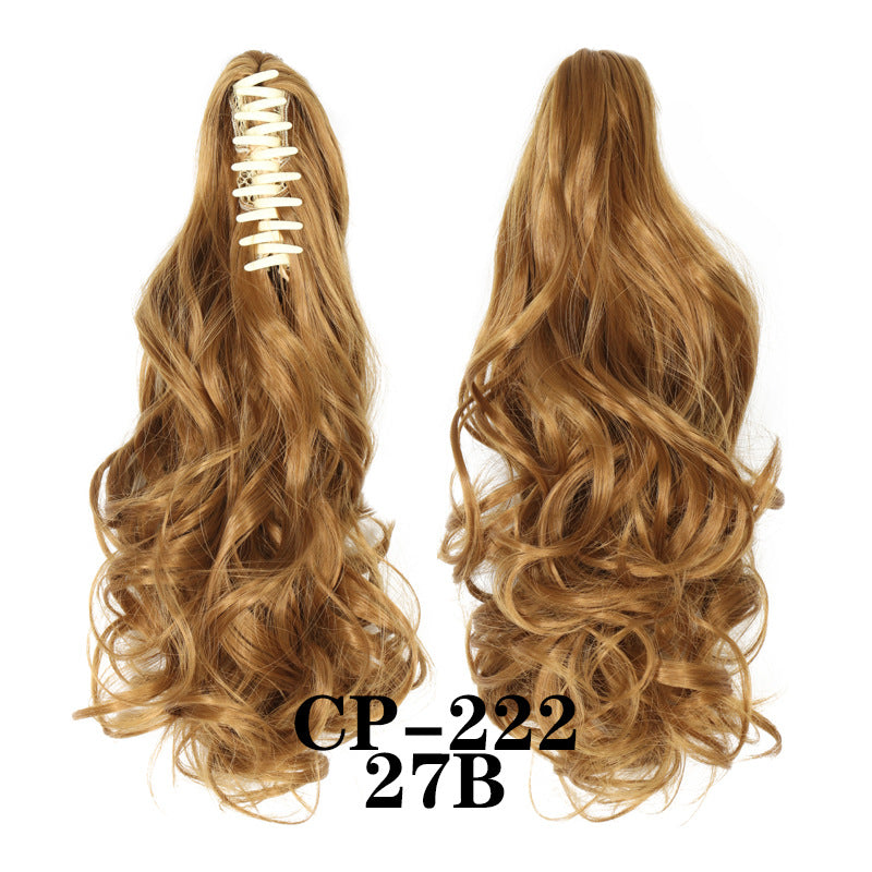 Wavy ponytail with curly hair and a tiger clip