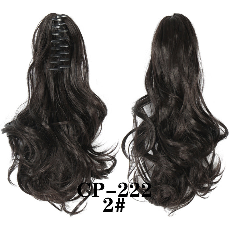 Wavy ponytail with curly hair and a tiger clip