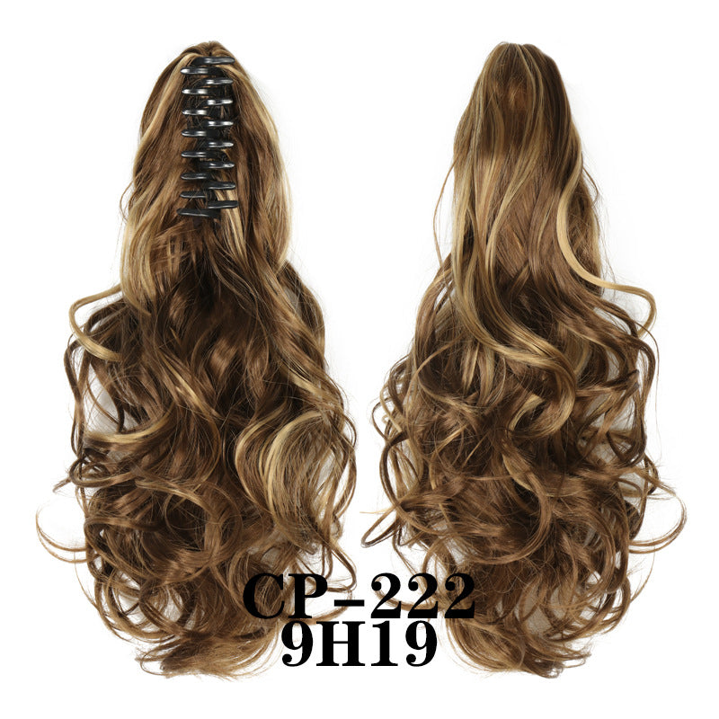 Wavy ponytail with curly hair and a tiger clip