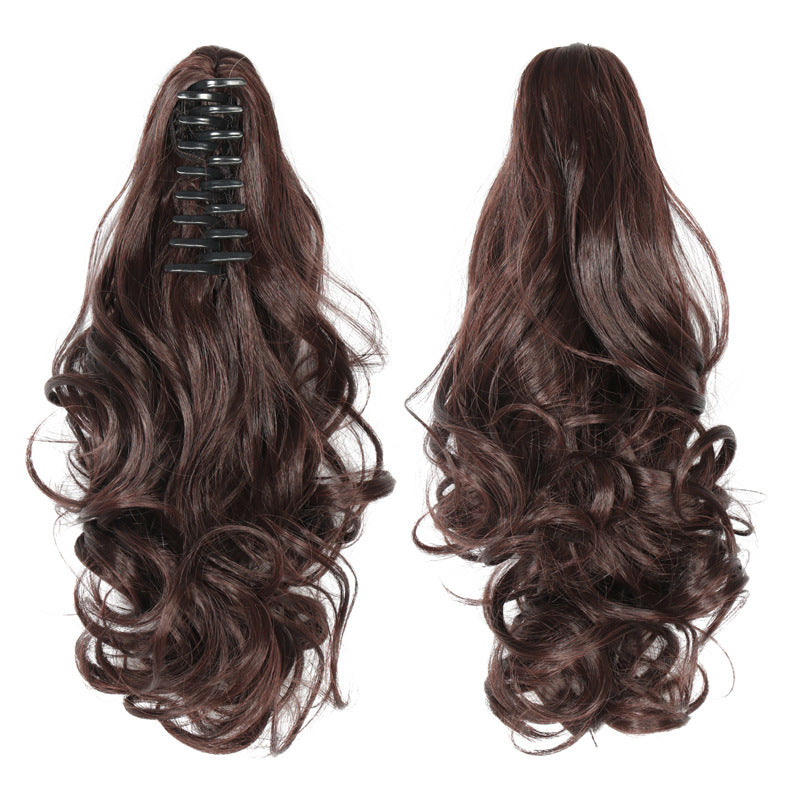 Wavy ponytail with curly hair and a tiger clip