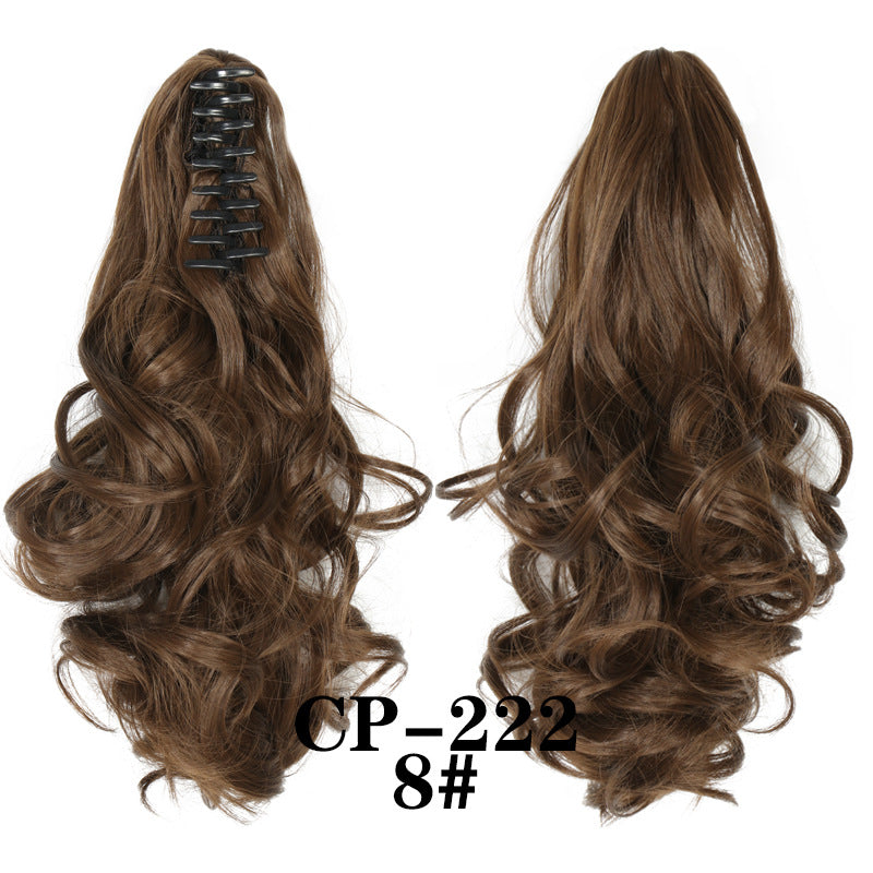 Wavy ponytail with curly hair and a tiger clip