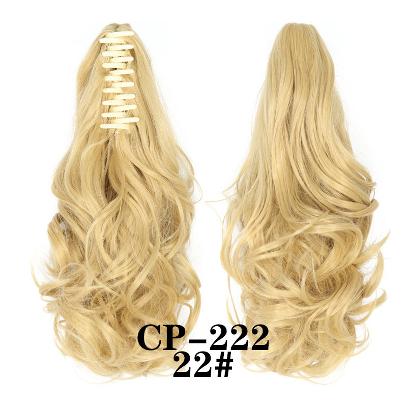 Wavy ponytail with curly hair and a tiger clip