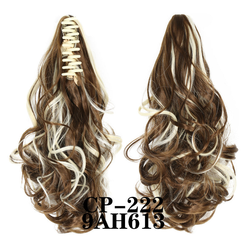 Wavy ponytail with curly hair and a tiger clip