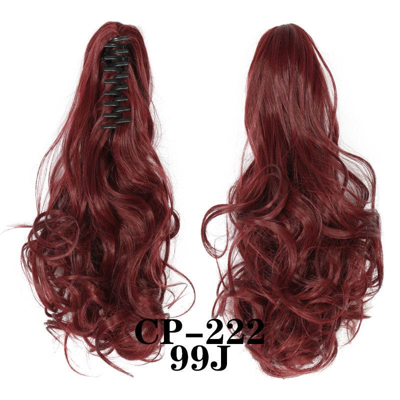 Wavy ponytail with curly hair and a tiger clip