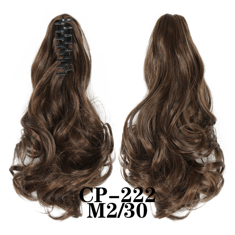 Wavy ponytail with curly hair and a tiger clip