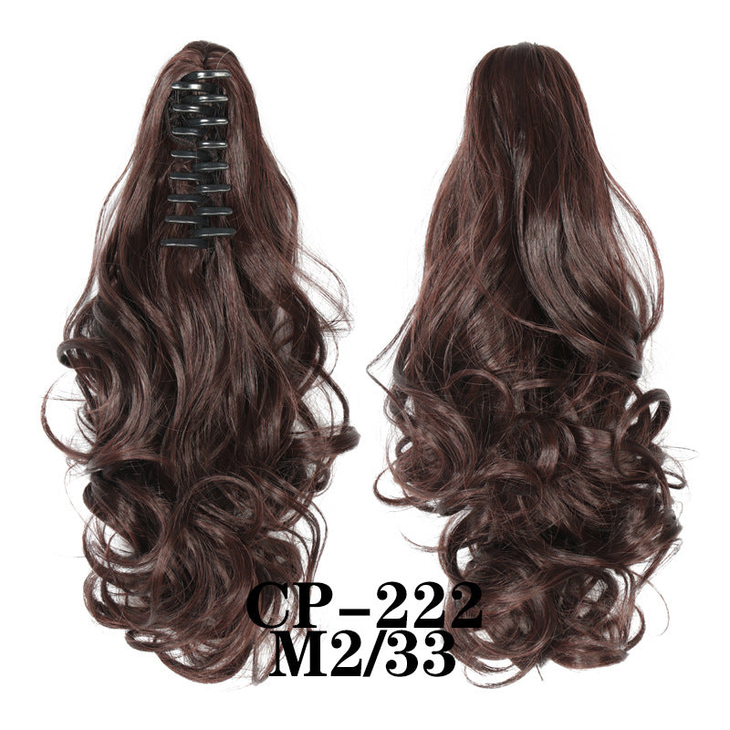 Wavy ponytail with curly hair and a tiger clip