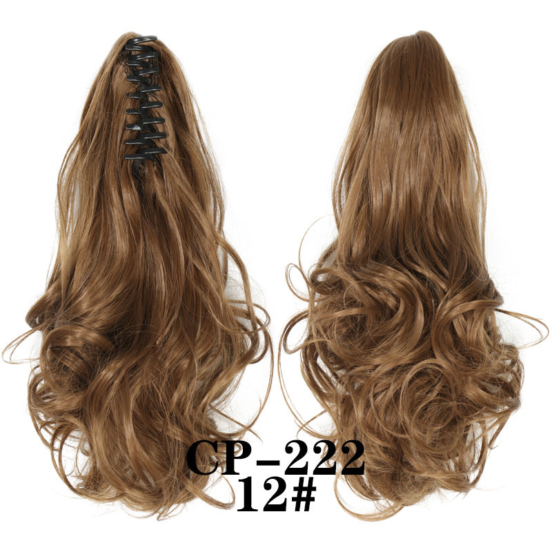 Wavy ponytail with curly hair and a tiger clip