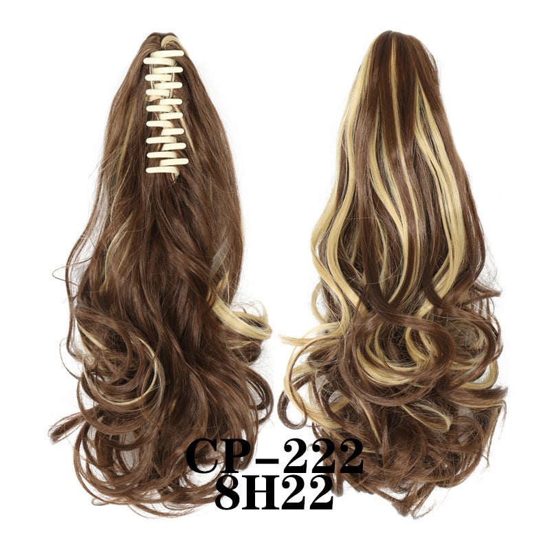 Wavy ponytail with curly hair and a tiger clip