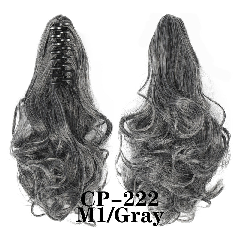 Wavy ponytail with curly hair and a tiger clip