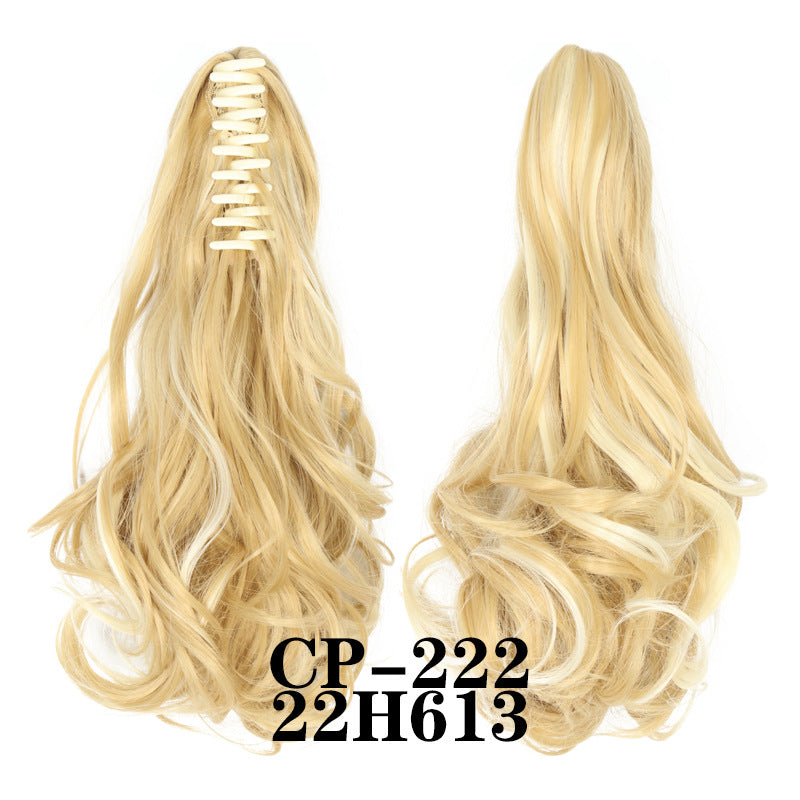 Wavy ponytail with curly hair and a tiger clip